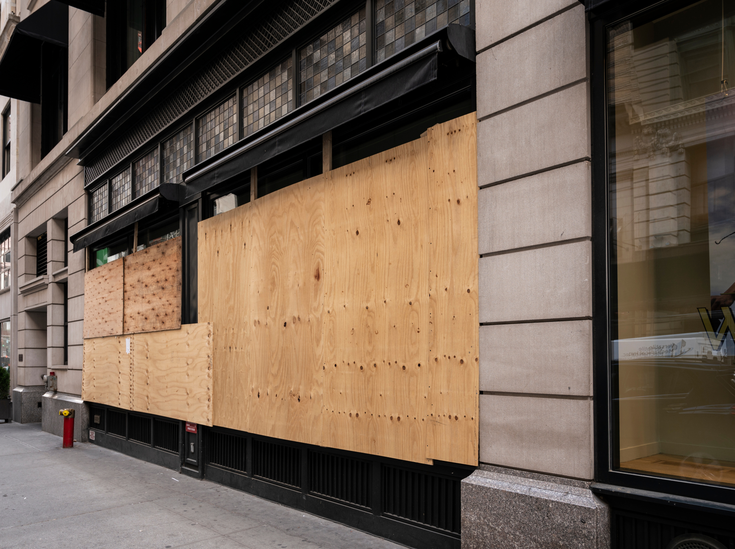 Boarded up store windows in Manhattan north of Madison Square.