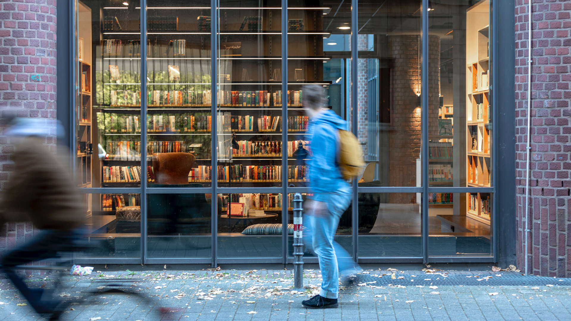 Cologne open library with colorful books and cabinets.