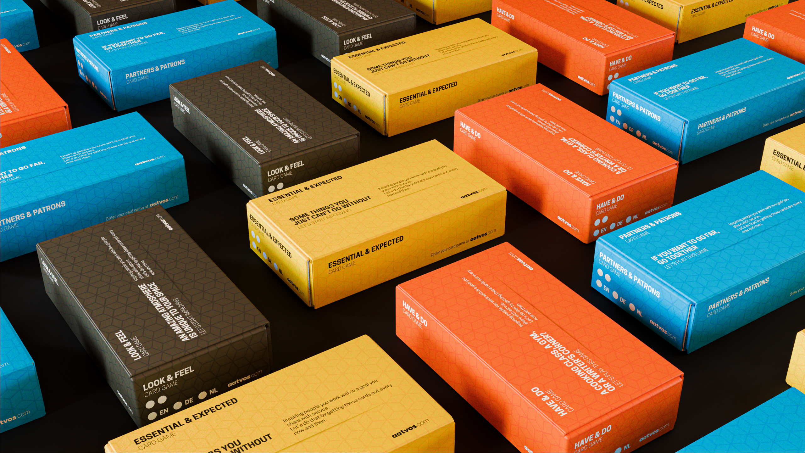 Boxes of card games at the includi webshop. Inspiring people to create a place where people feel welcome.