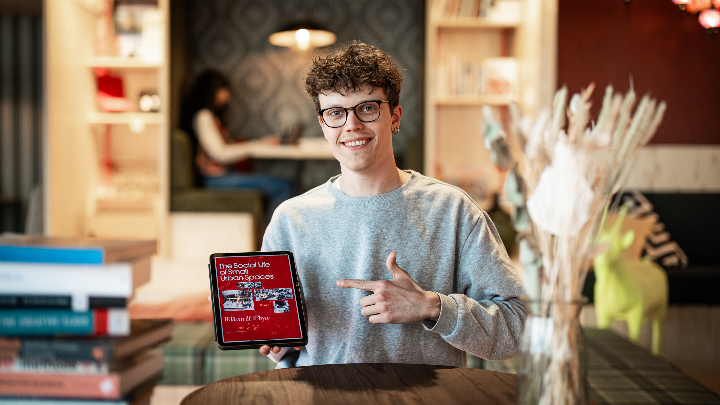 Jaap Bouwman Social Geographer with his favorite book.